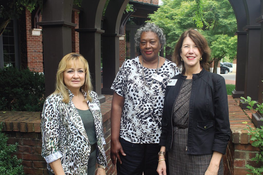 Library Director Sue DeBrecht, right, said the 50th anniversary of Emmet O’Neal Library Sept. 12 is a landmark event for the library and its employees, which include Technical Services Department Head Nancy Sexton, left, employed for 34 years, and the library’s longest-term employee Doris Young, center, employed for 37 years. Journal photo by Emily Williams