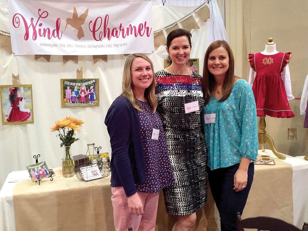Sisters-in-law Mary Beth, Sandi and Jamie Meeks recently debuted their first line of Wind Charmer clothing at the Southern Women’s Show Sept. 29-Oct. 1. Inspired by their daughters, the company is dedicated to creating vintage-inspired dresses for young girls. Photo special to the Journal