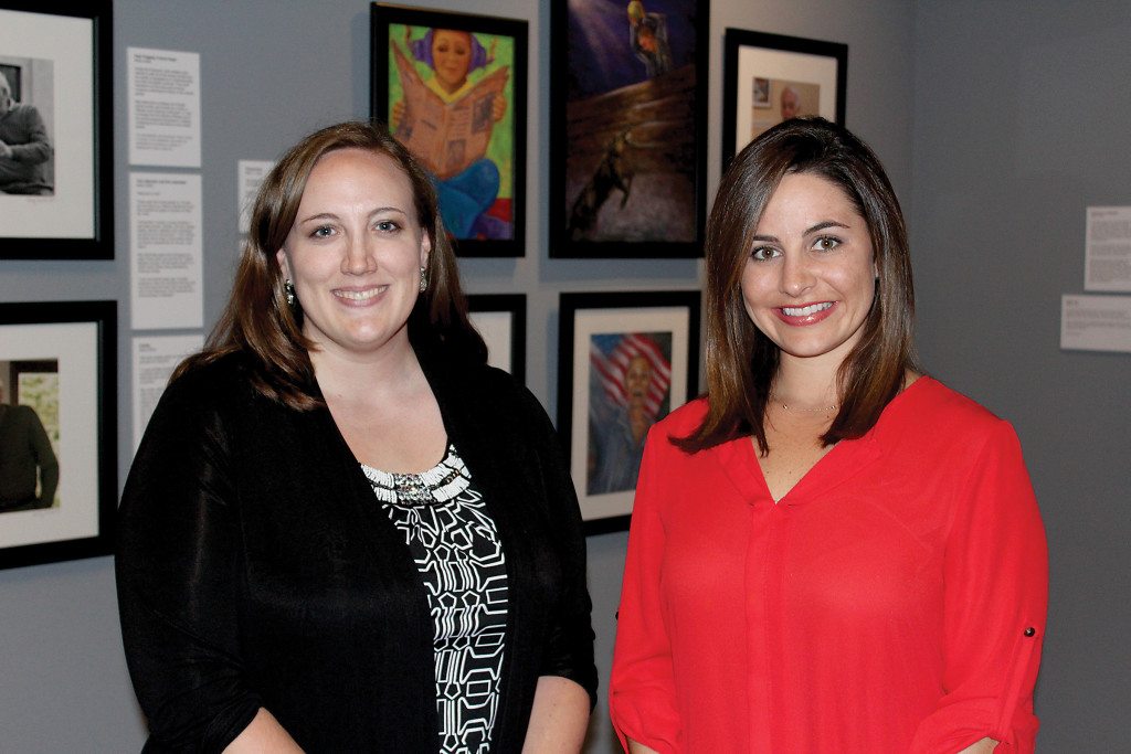 Vulcan Park and Museum’s Lindsay Elliott, left, and Morgan Berney. Below, art by Mitzi J. Levin focuses on life before and during imprisonment or hiding, as well as escape or liberation. Journal photo by Emily Williams
