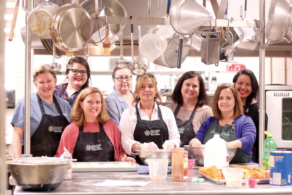 At a Cooks On A Mission session to prep Thanksgiving food in the kitchen at Mountain Brook Baptist Church are front, from left: Kim Hardwick, Aimee Turner, Lisa Elliott and Karen Abel. Back: Erin Futch, Jane Hauth, Sherrie Futch and Joann Stramaglia. Journal photo by Kaitlin Candelaria