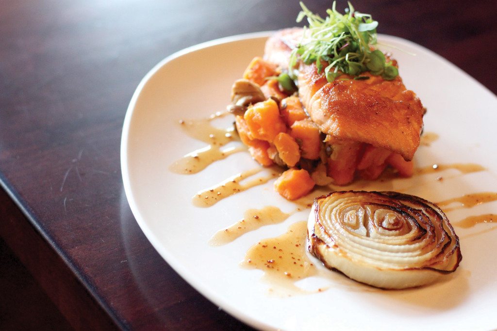  Scottish Salmon Brulee is served with sweet potato hash and a caramelized onion.