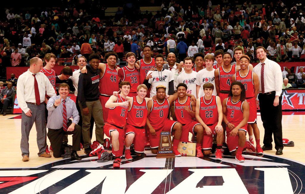 Homewood team members and coaches with the school's first-ever state championship trophy in boys basketball. Journal photo by Marvin Gentry.