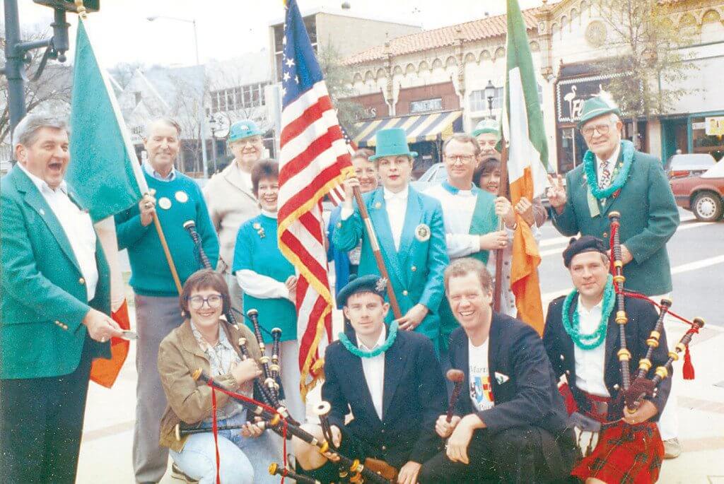 In 1986, the Birmingham Irish Cultural Society led a protest parade after the official event was canceled by the Downtown Action Committee because due to weather; front: Marty Connors kneeling with unidentified Scottish bagpipe players. Back, from left: members Billy Grey, Kevin McEntarget, unidentified guest, helen McMahon, Danny Patterson, Elaine Connors and former Birmingham Mayor George Seilbels. Photos special to the Journal.