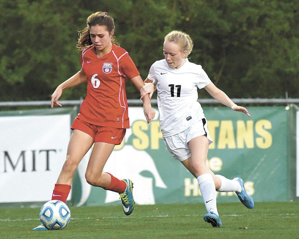 Vestavia Hills' Taylor Korn (6) and Mountain Brook's Emily McLean are shown in action at Mountain Brook High School in Mountain Brook, Ala., Tuesday, March 15, 2016. (OTMJ Photo/ Mark Almond)