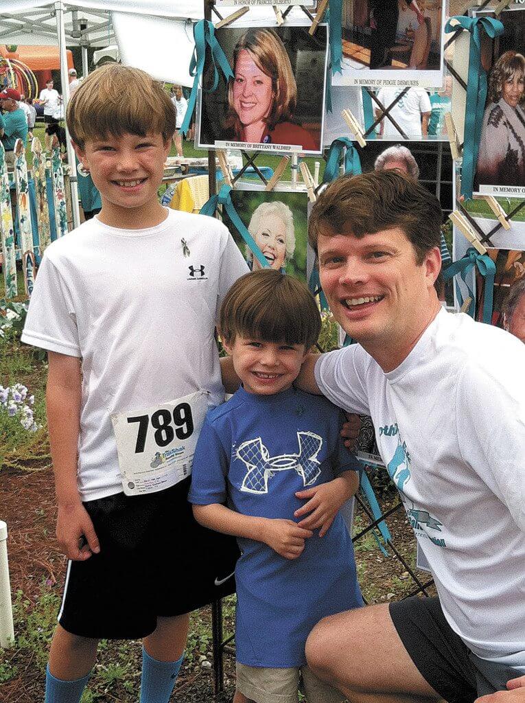 Todd Miner with his sons Graham and Britton at the 2014 Motherwalk. Photos special to the Journal.