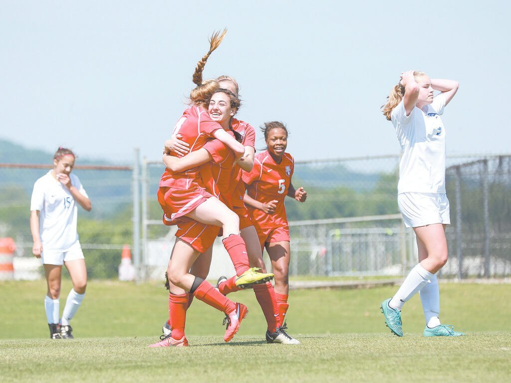 Vestavia’s Sophia Kamburis, left, celebrates a goal with teammate Sara MCurry. Kamburis, a senior, was named Most Valuable Player. Chad Jeter, below, scored the Eagles’ first goal in the first half. Jeter was named the tournament’s Most Valuable Player. Journal photos by Marvin Gentry.