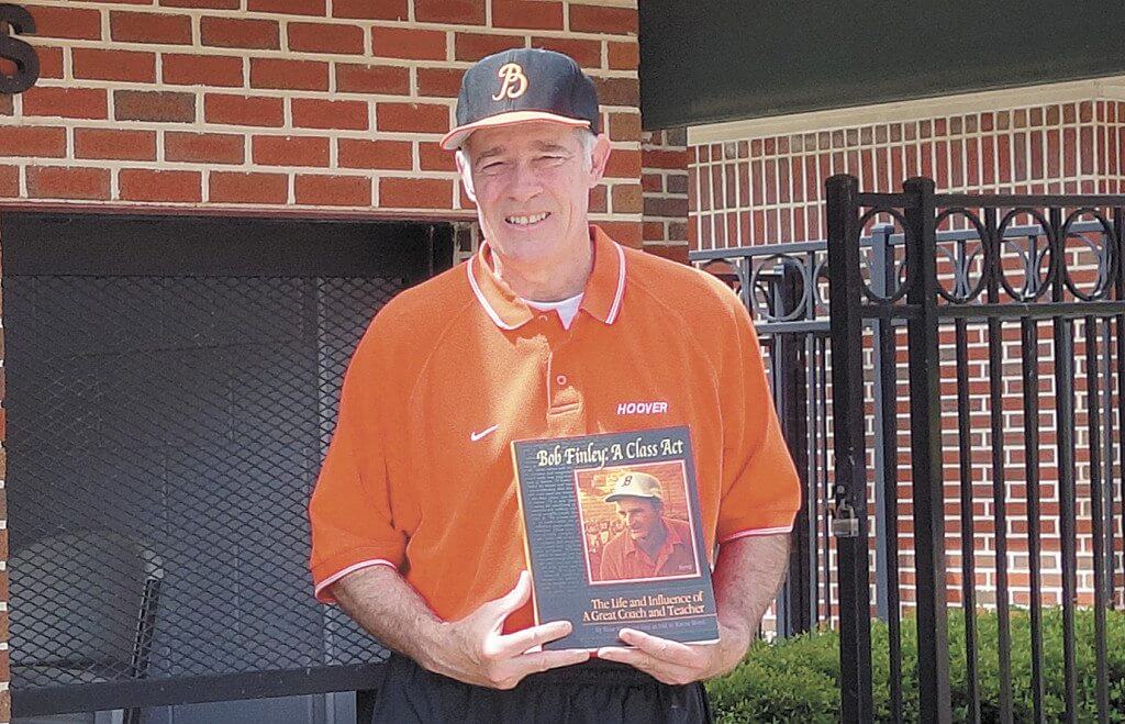 Wayne Wood with the book he wrote on Berry High School's legendary coach "Bob Finley: A Class Act - The Life and Influences of a Great Coach and Teacher." Photo by Sarah Kuper.