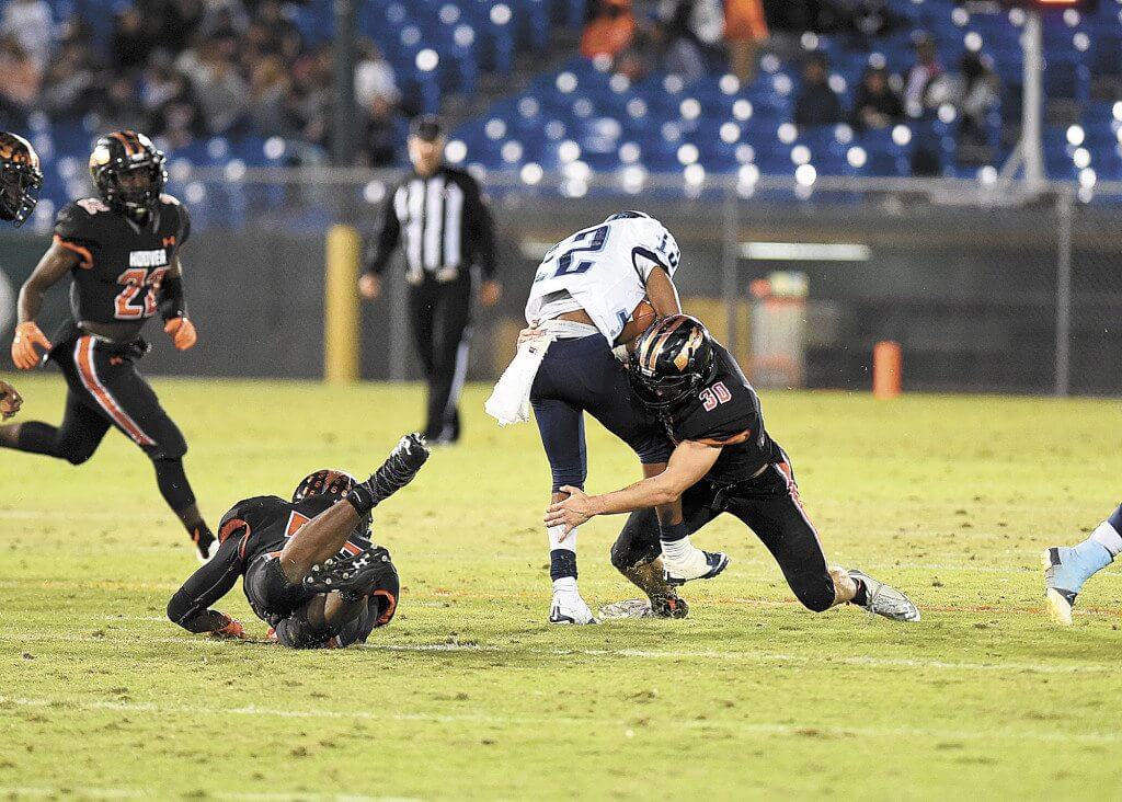 Hoover’s Ben Abercrombie stops a James Clemens running back. The Bucs held the potent Jet attack to a mere 146 yards of total offense for the night. Photo courtesy of Bryan Bunch.