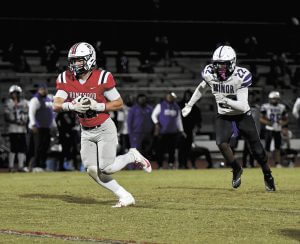 Homewood Tight End JT Watts runs after catching a pass against Minor, Friday, October 24.