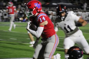 Vestavia Hills' Luke Stubbs returning a punt for a touchdown during the Rebels' 39-30 victory over Hoover, Friday, October 24.