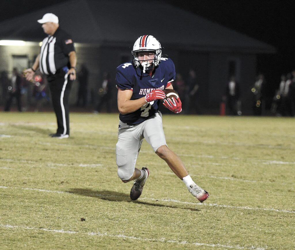 Homewood running back Reid Goldstein runs after catching a pass from Kaleb Carson during the Patriots' 38-14 playoff win over Pell City, Friday, November 7.