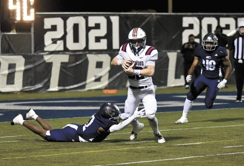 Homewood Tight End JT Watts runs through a Clay-Chalkville defender during the Patriots' playoff loss Friday, November 21.