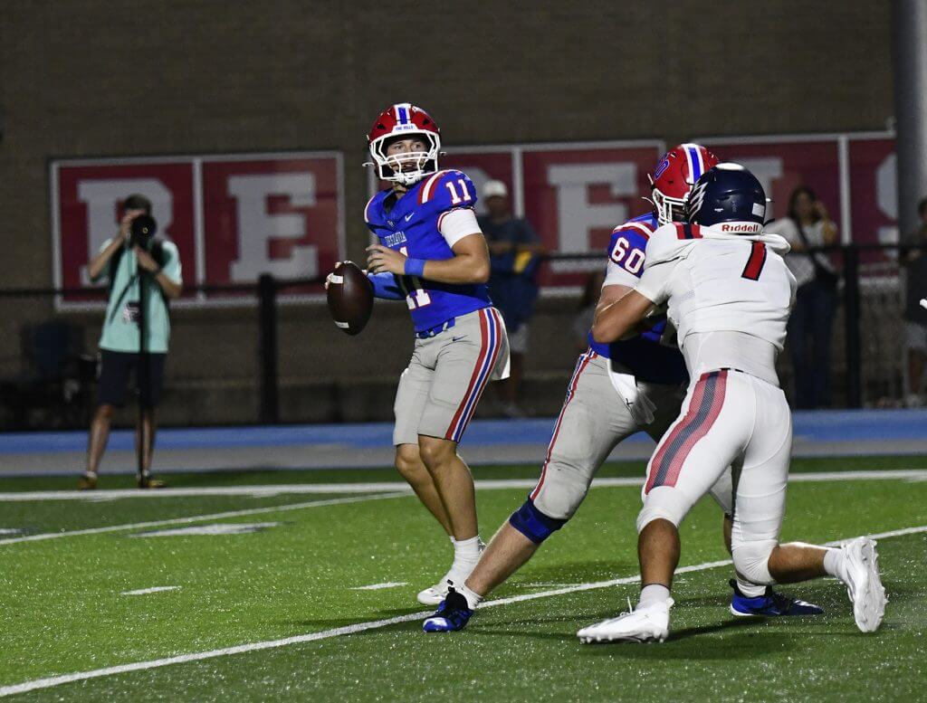 Vestavia Hills quarterback Charlie Taaffe setting up for a pass during the Rebels 43-13 win over Oak Mountain, Friday, September 11.