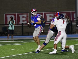 Vestavia Hills quarterback Charlie Taaffe setting up for a pass during the Rebels 43-13 win over Oak Mountain, Friday, September 11.