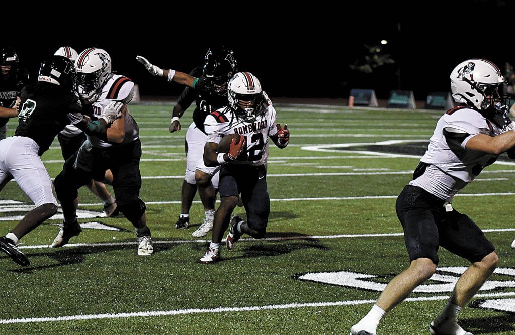 Homewood quarterback Timothy Roshell runs the ball during the Patriots' road win over Pelham, 42-7