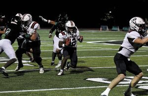 Homewood quarterback Timothy Roshell runs the ball during the Patriots' road win over Pelham, 42-7