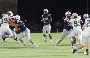 Homewood quarterback Timothy Roshell sets up for a pass during the Patriots 33-13 win over Mountain Brook.