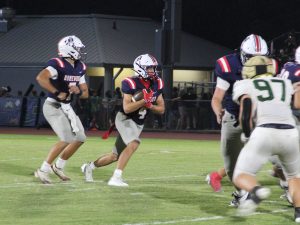 Reid Goldstein runs the ball against during Homewood's 33-13 victory over Mountain Brook, Friday, September 4, 2026.