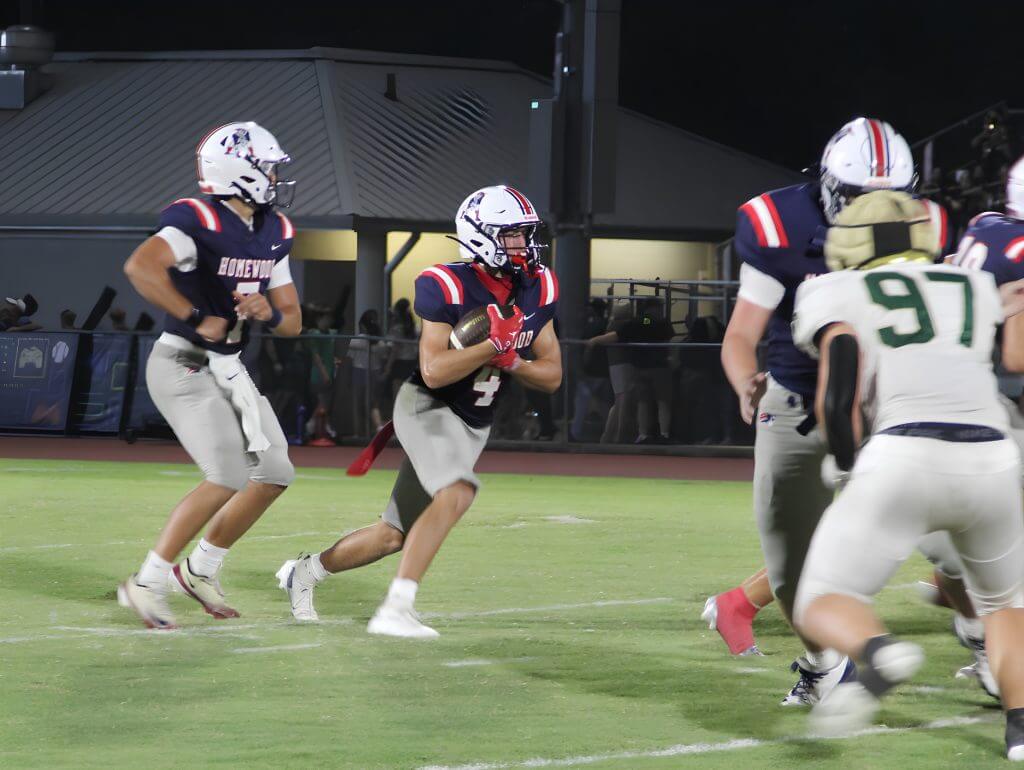 Reid Goldstein runs the ball against during Homewood's 33-13 victory over Mountain Brook, Friday, September 4, 2026.