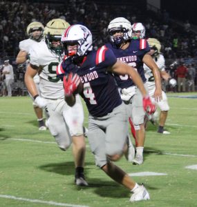 Reid Goldstein runs the ball against during Homewood's 33-13 victory over Mountain Brook, Friday, September 4, 2026.